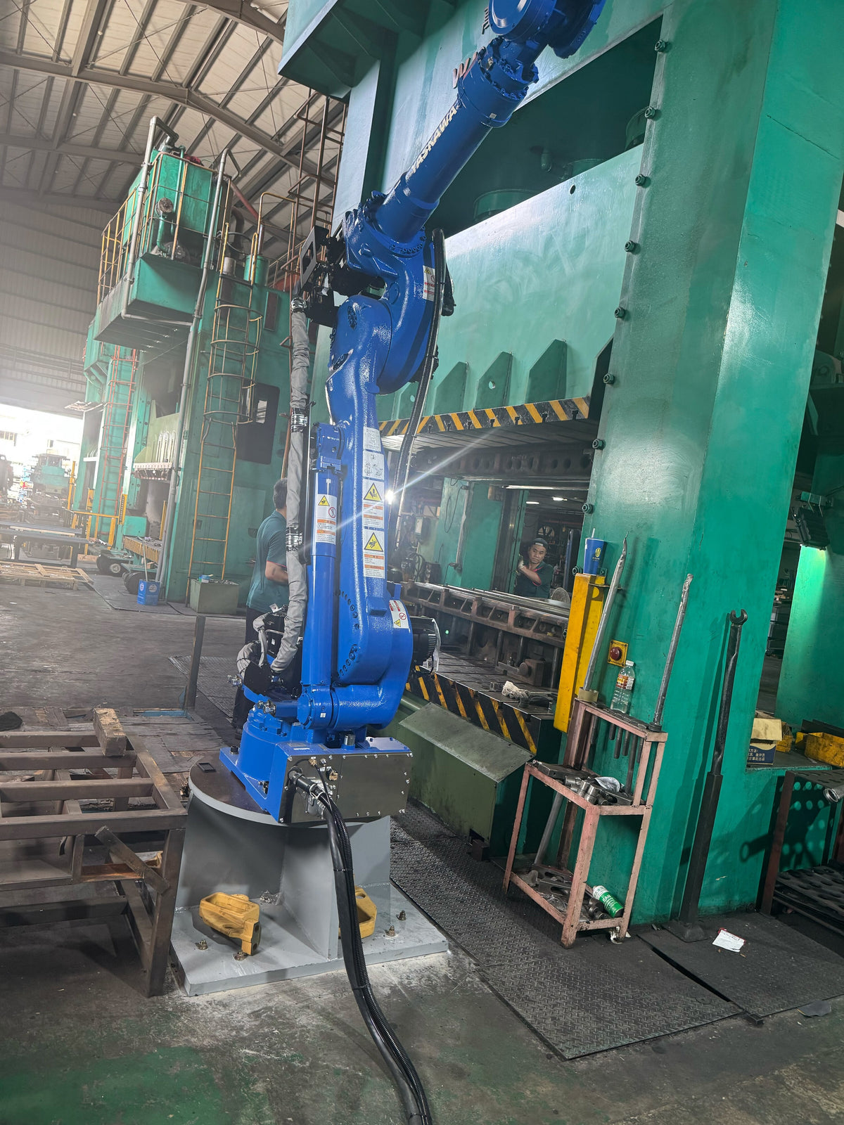 Robotic arm at the stamping line