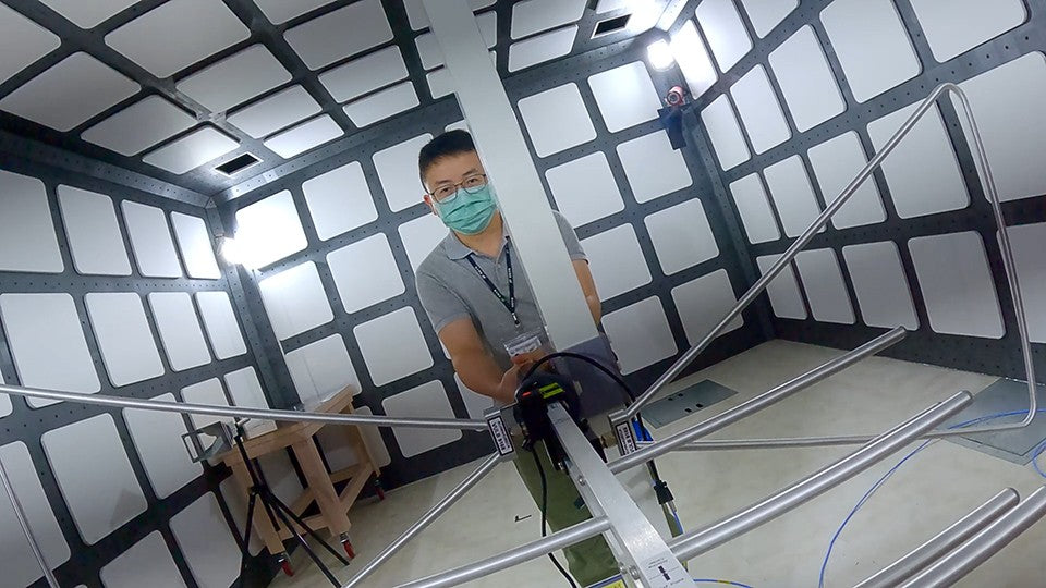 Engineer positioning the measurement antenna in JET's RF semi-anechoic chamber