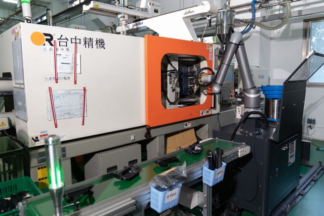 Automated injection molding with collaborative robots